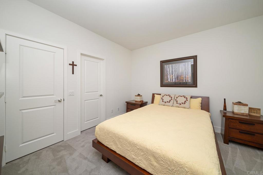 35764 Bay Morgan Lane Fallbrook, CA 92028 - Photo 42 of 69 a bedroom with a bed and a potted plant