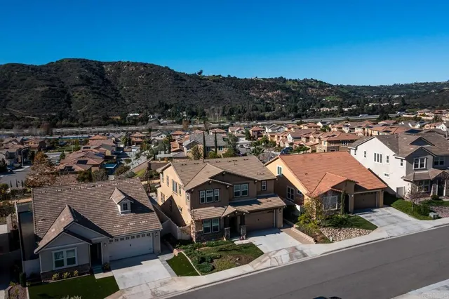an aerial view of a house with outdoor space