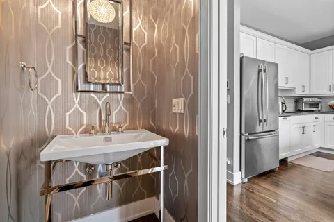 a kitchen with stainless steel appliances a refrigerator and a sink