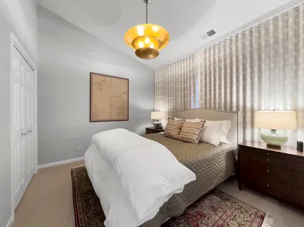 a bedroom with bed and a window