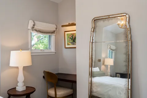 a bathroom with a toilet tub and a window