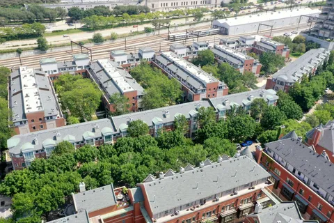 an aerial view of a house with a yard lake and outdoor space
