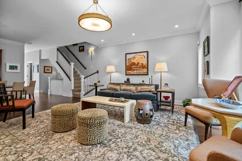 a living room with furniture and a chair