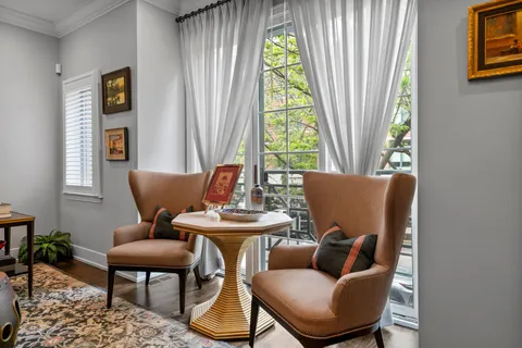 a view of a dining room with furniture and a window