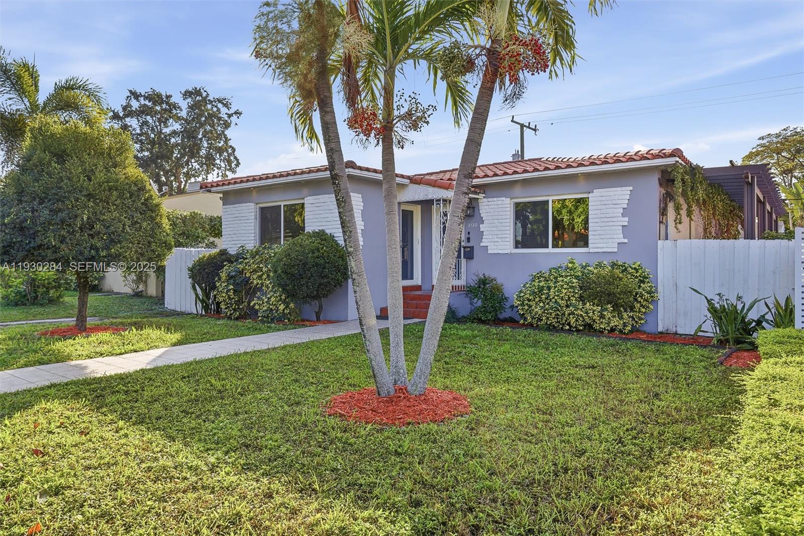 2120 Southwest 16th Street Miami, FL 33145 - Photo 1 of 47 a front view of a house with garden