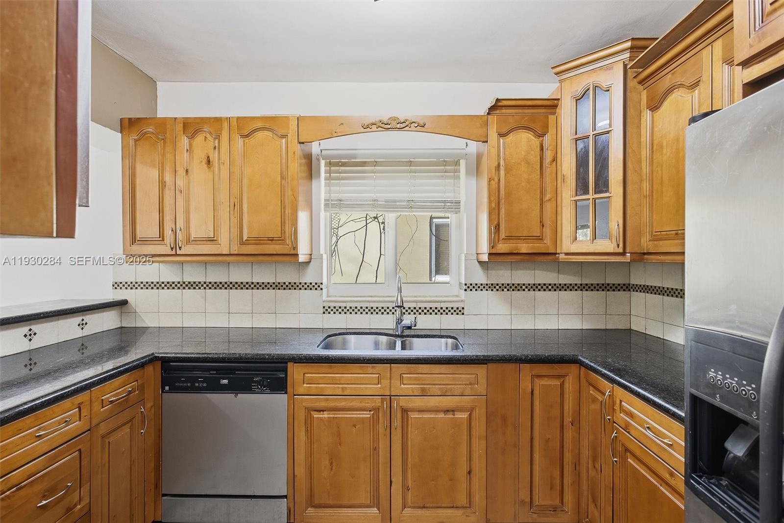 2120 Southwest 16th Street Miami, FL 33145 - Photo 16 of 47 a kitchen with stainless steel appliances granite countertop a sink and cabinets