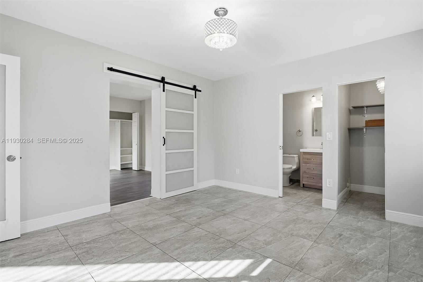 2120 Southwest 16th Street Miami, FL 33145 - Photo 18 of 47 an empty room with closet and a bathroom