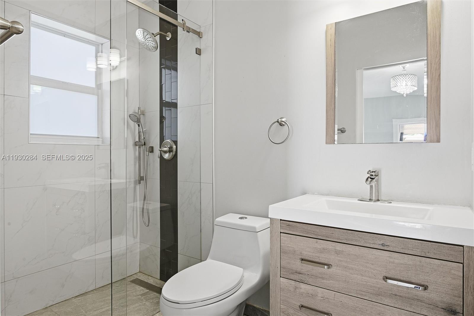 2120 Southwest 16th Street Miami, FL 33145 - Photo 20 of 47 a bathroom with a sink a toilet and shower