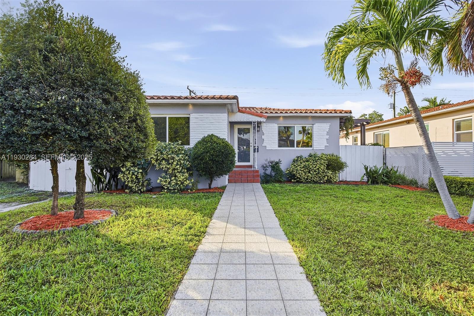 2120 Southwest 16th Street Miami, FL 33145 - Photo 2 of 47 a front view of house with yard and green space