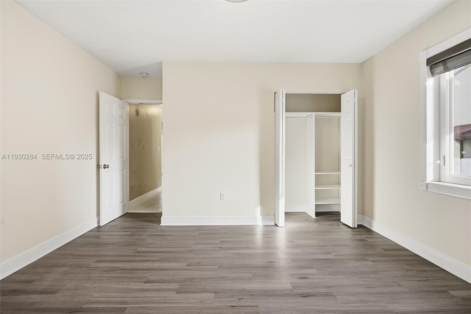 2120 Southwest 16th Street Miami, FL 33145 - Photo 21 of 47 an empty room with wooden floor and windows