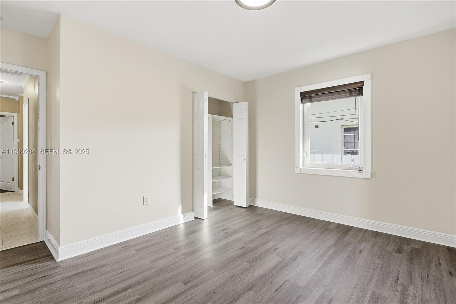2120 Southwest 16th Street Miami, FL 33145 - Photo 22 of 47 an empty room with wooden floor and windows