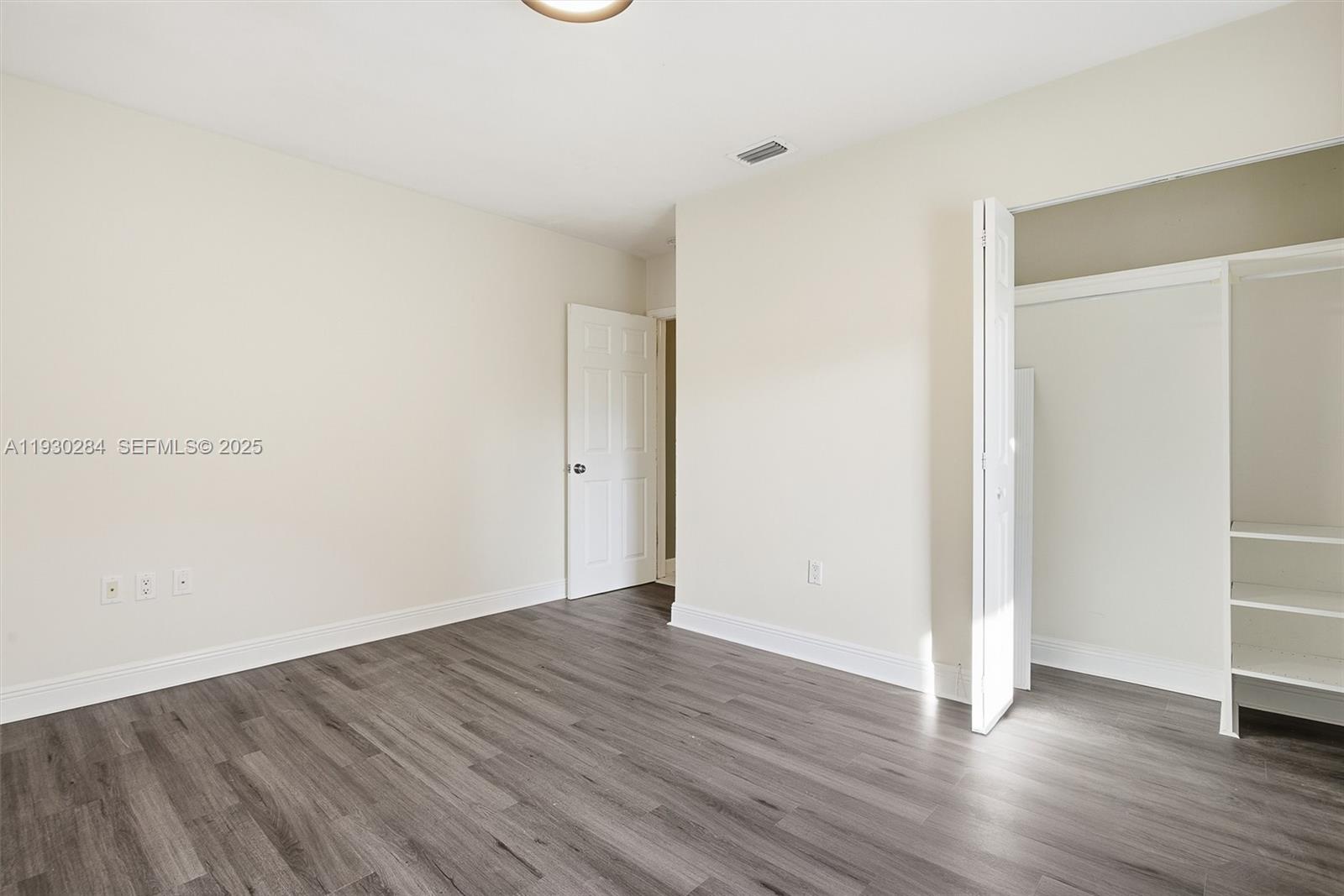 2120 Southwest 16th Street Miami, FL 33145 - Photo 23 of 47 a view of an empty room with wooden floor
