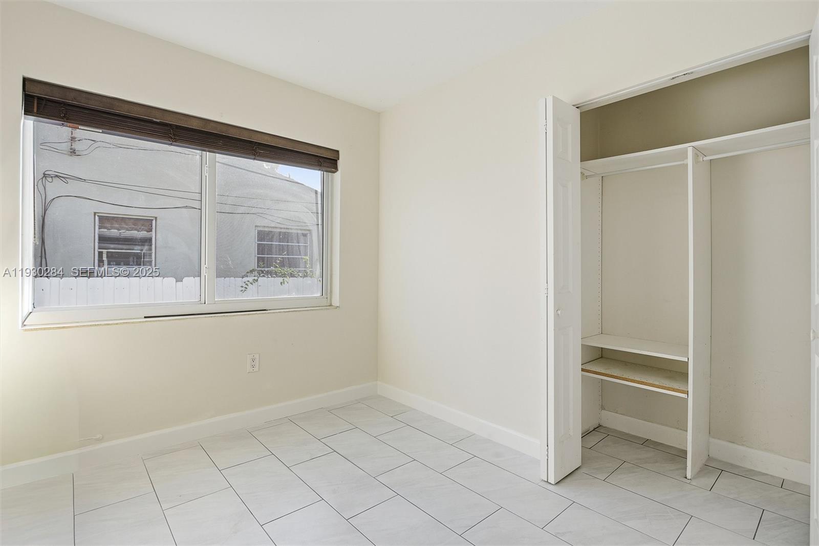2120 Southwest 16th Street Miami, FL 33145 - Photo 24 of 47 a view of an empty room with cabinet and mirror