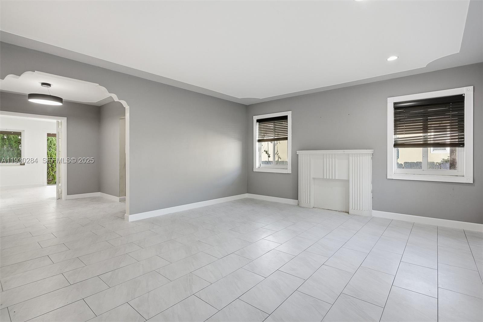 2120 Southwest 16th Street Miami, FL 33145 - Photo 3 of 47 a view of an empty room with a window