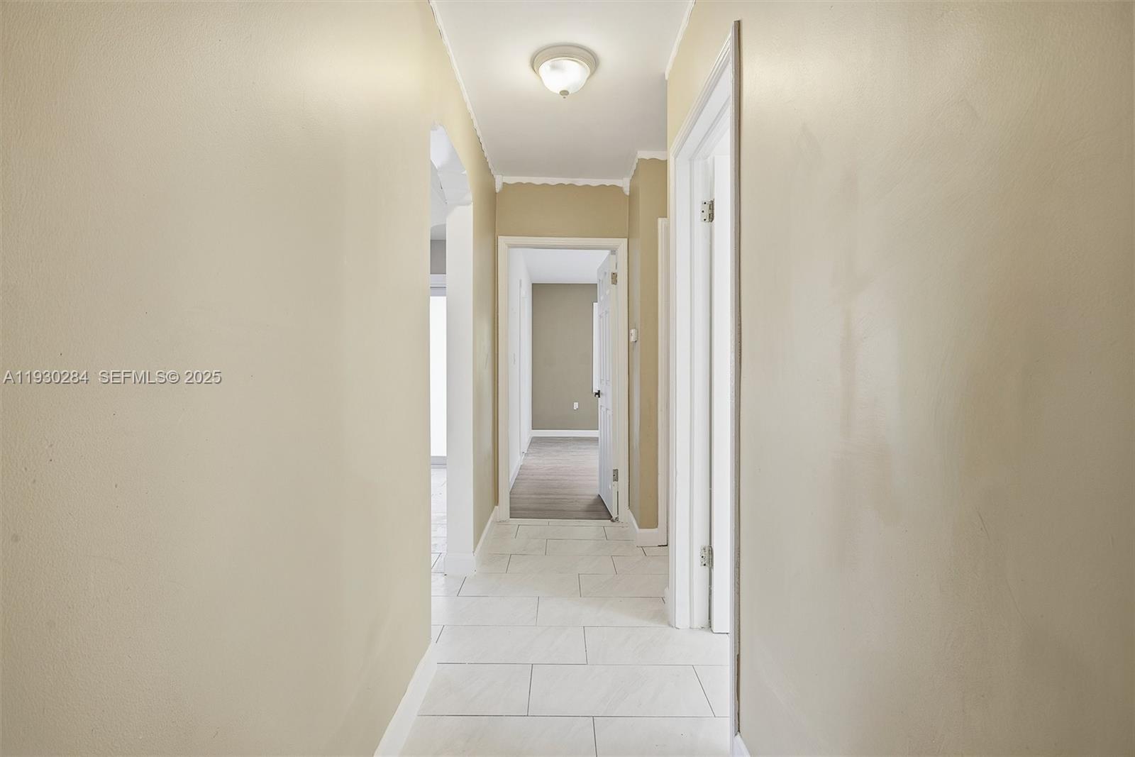2120 Southwest 16th Street Miami, FL 33145 - Photo 31 of 47 a view of a hallway with wooden floor and a door