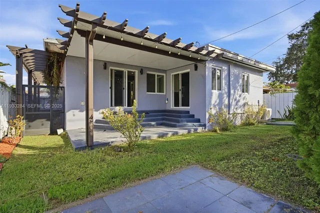 front view of a house with a yard