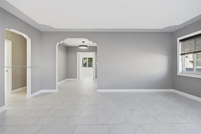 a view of an empty room with a window