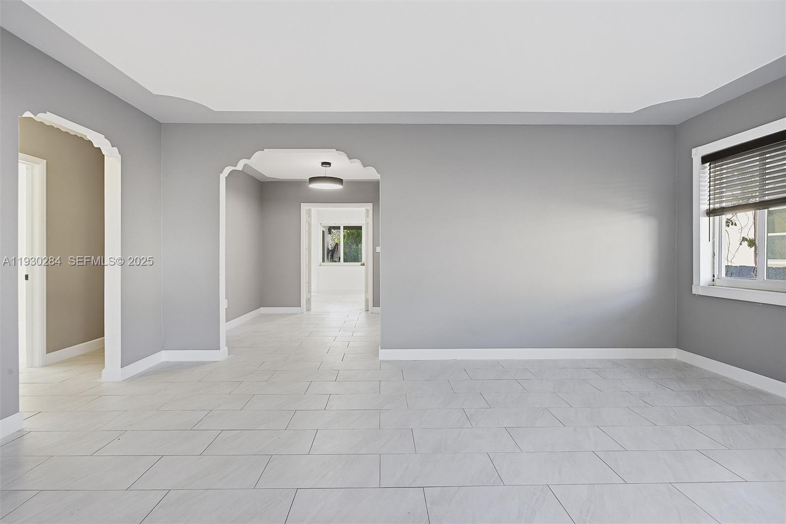 2120 Southwest 16th Street Miami, FL 33145 - Photo 4 of 47 a view of an empty room with a window