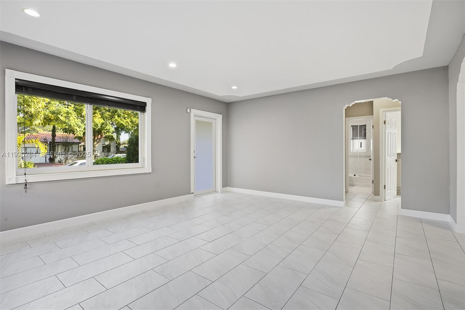 2120 Southwest 16th Street Miami, FL 33145 - Photo 6 of 47 a view of an empty room with a window