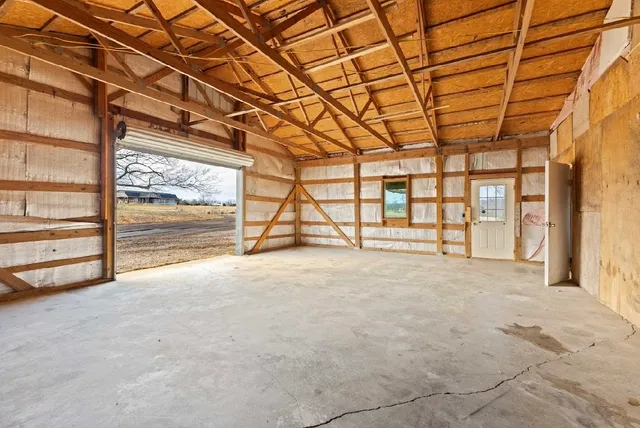 a view of empty room with ceiling fan