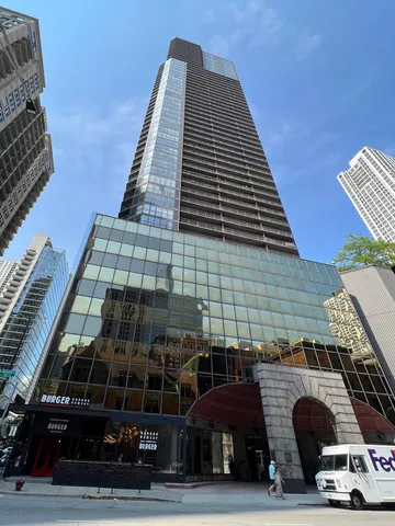 a front view of a building with parking space