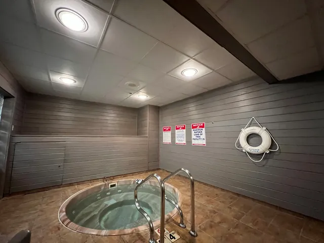 a bathroom with a tub and shower