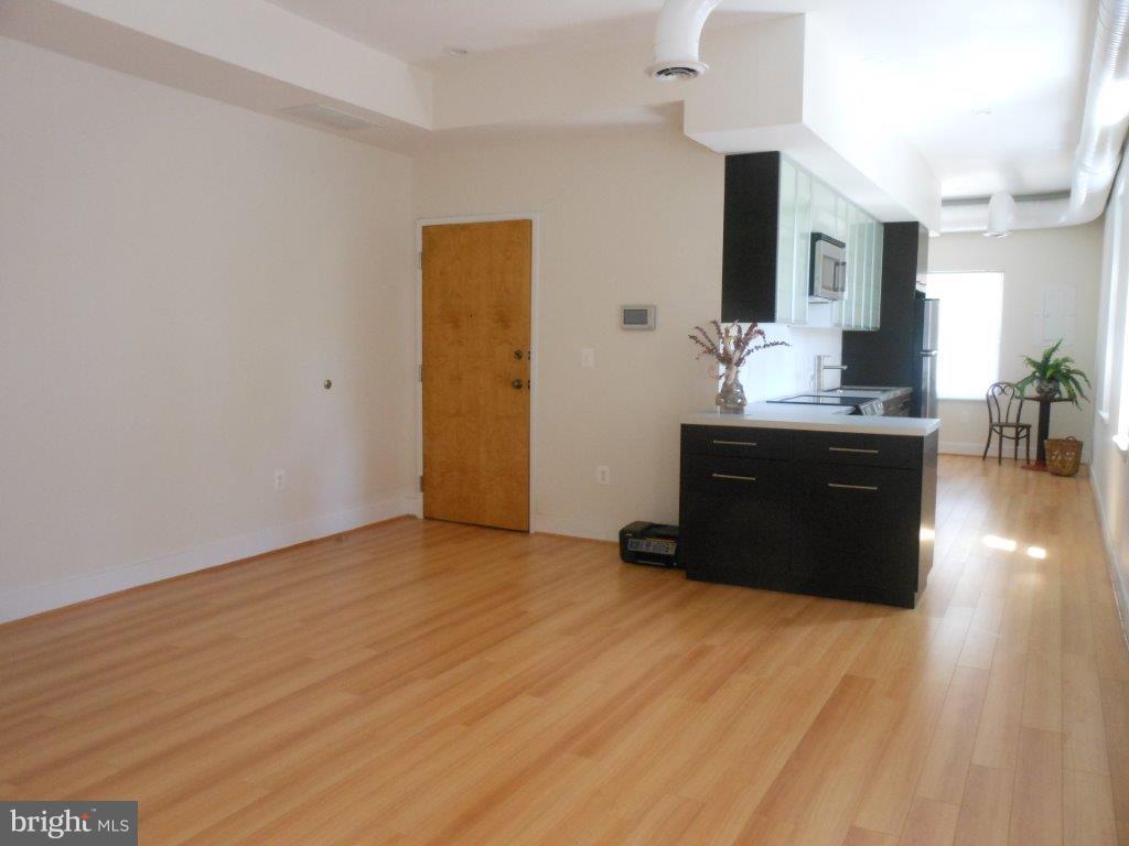 218 East Chase Street, Unit 3 Baltimore, MD 21202 - Photo 2 of 13 Living Room/Kitchen Area