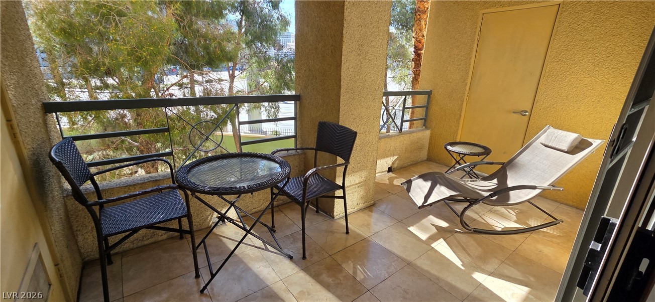 210 East Flamingo Road, Unit 208 Las Vegas, NV 89169 - Photo 27 of 42 Enjoy outdoor living on this charming patio, perfect for relaxing in the sun.