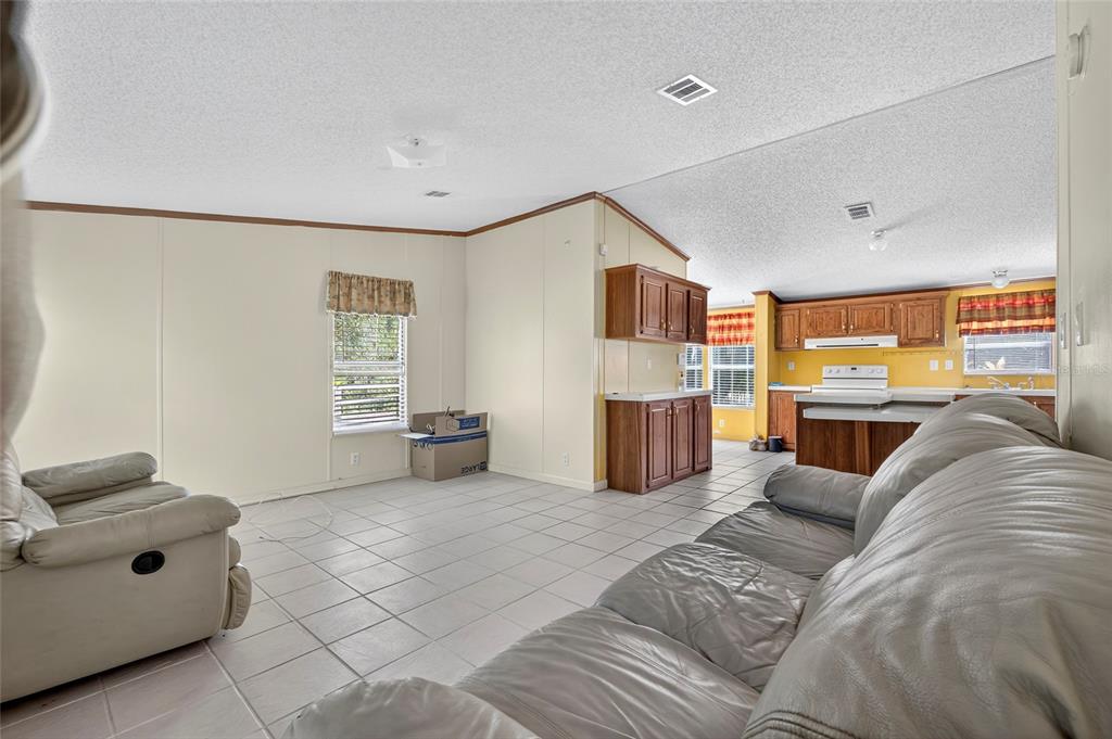 4661 Shepherd Road Lakeland, FL 33811 - Photo 11 of 33 a living room with furniture and a couch