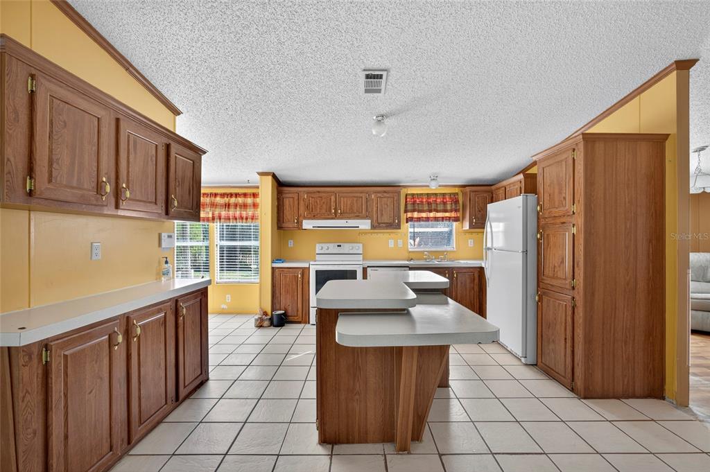 4661 Shepherd Road Lakeland, FL 33811 - Photo 12 of 33 a kitchen with stainless steel appliances granite countertop a sink and cabinets