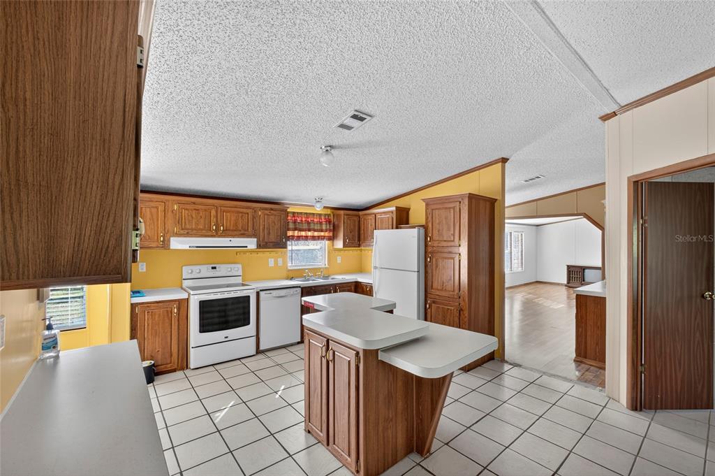 4661 Shepherd Road Lakeland, FL 33811 - Photo 13 of 33 a kitchen with cabinets and stainless steel appliances