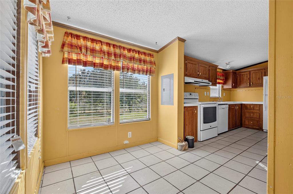 4661 Shepherd Road Lakeland, FL 33811 - Photo 16 of 33 a view of a kitchen with furniture and an empty room