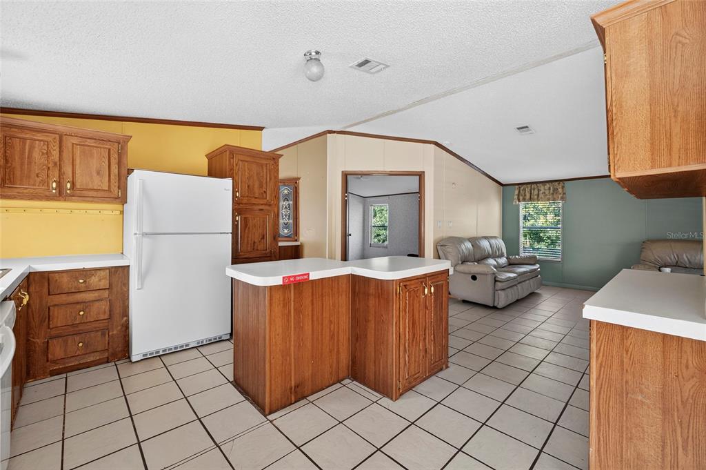 4661 Shepherd Road Lakeland, FL 33811 - Photo 17 of 33 a kitchen with stainless steel appliances granite countertop a refrigerator and a stove