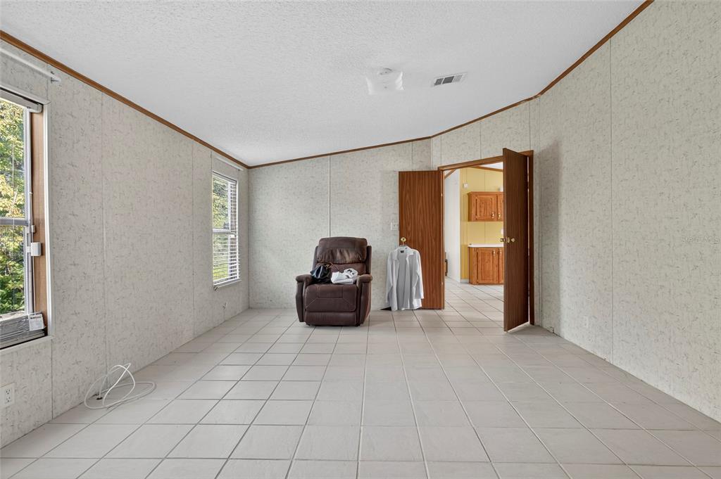 4661 Shepherd Road Lakeland, FL 33811 - Photo 20 of 33 a living room with furniture and a window