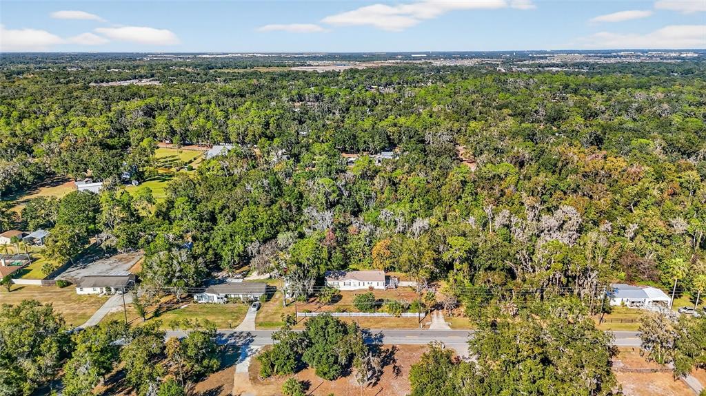 4661 Shepherd Road Lakeland, FL 33811 - Photo 2 of 33 a view of a city with lush green forest