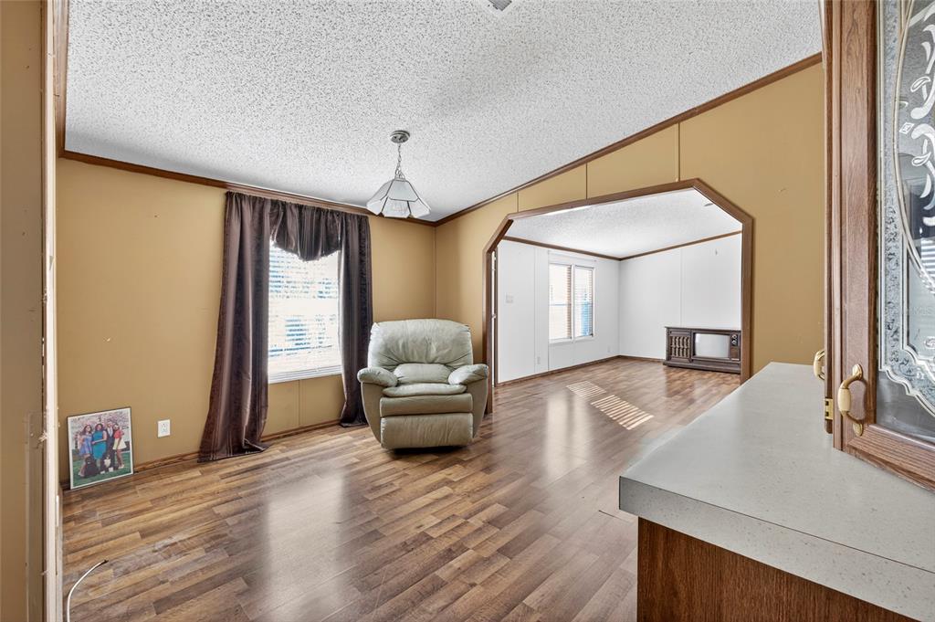 4661 Shepherd Road Lakeland, FL 33811 - Photo 23 of 33 a living room with furniture and a wooden floor