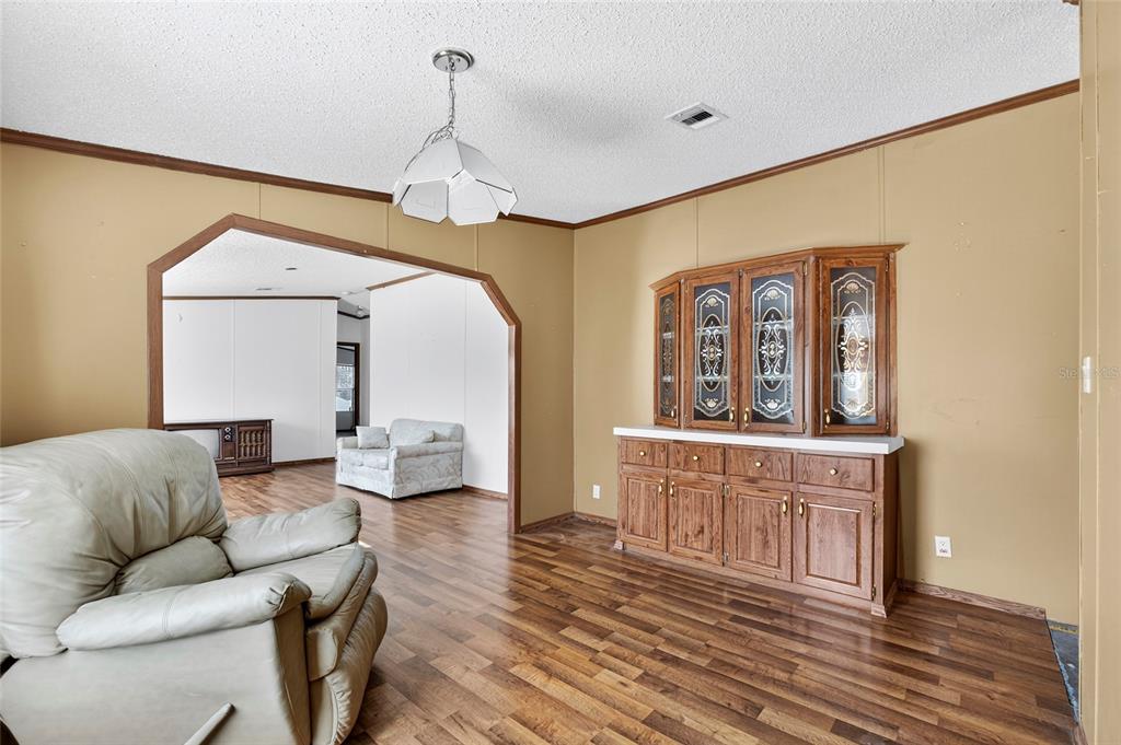 4661 Shepherd Road Lakeland, FL 33811 - Photo 24 of 33 a living room with furniture and a wooden floor