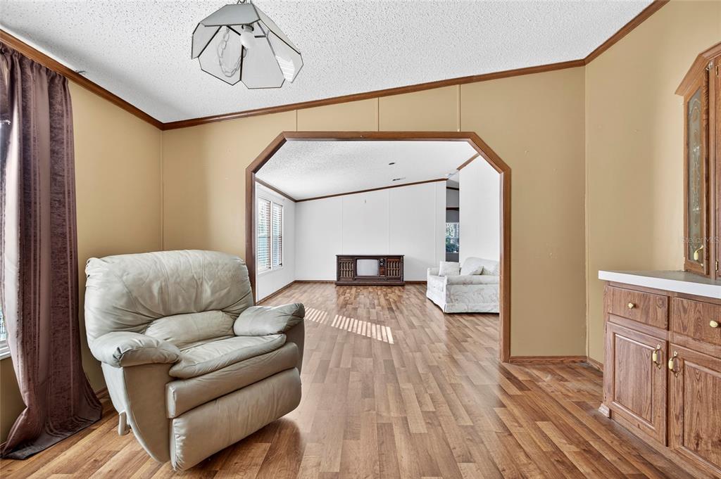 4661 Shepherd Road Lakeland, FL 33811 - Photo 25 of 33 a living room with furniture and a wooden floor