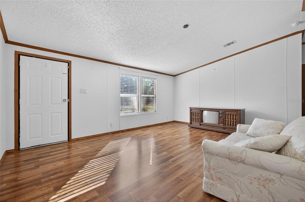 4661 Shepherd Road Lakeland, FL 33811 - Photo 26 of 33 a living room with furniture and a wooden floor