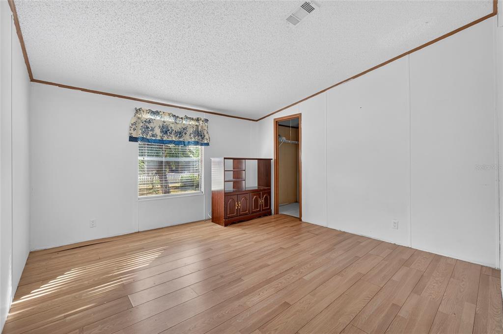 4661 Shepherd Road Lakeland, FL 33811 - Photo 28 of 33 a view of an empty room with wooden floor and a window