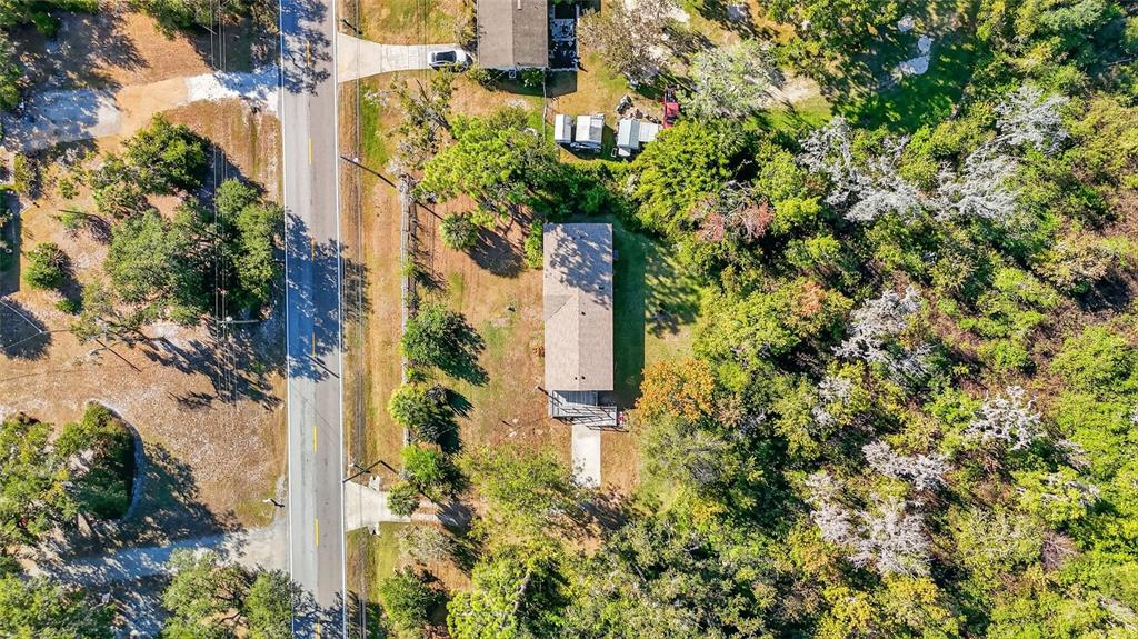 4661 Shepherd Road Lakeland, FL 33811 - Photo 3 of 33 an aerial view of residential house with outdoor space and trees all around