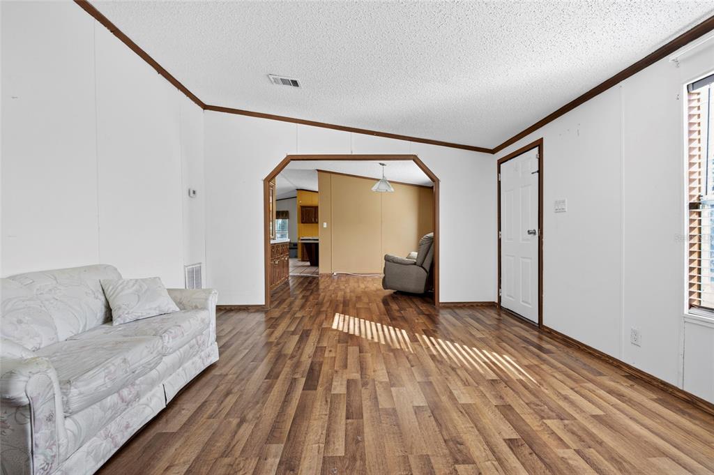 4661 Shepherd Road Lakeland, FL 33811 - Photo 32 of 33 a living room with furniture and a wooden floor