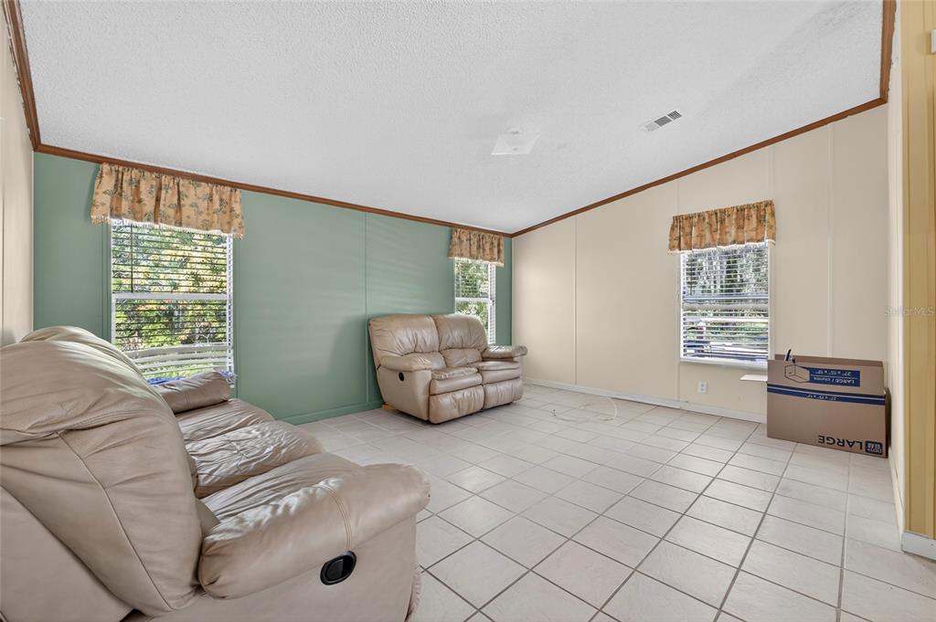 4661 Shepherd Road Lakeland, FL 33811 - Photo 9 of 33 a living room with furniture and a window
