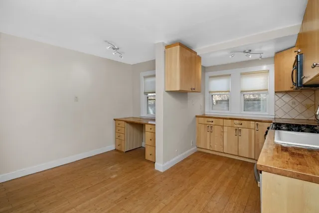 a bathroom with a sink a mirror and a toilet