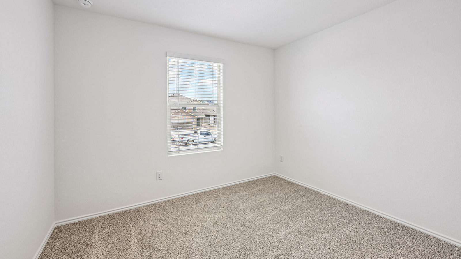 369 Old Stage Coach Road Jarrell, TX 76537 - Photo 17 of 25 A single window provides natural illumination to this carpeted bedroom.