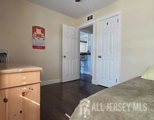 a bedroom with a bed and a view of bathroom