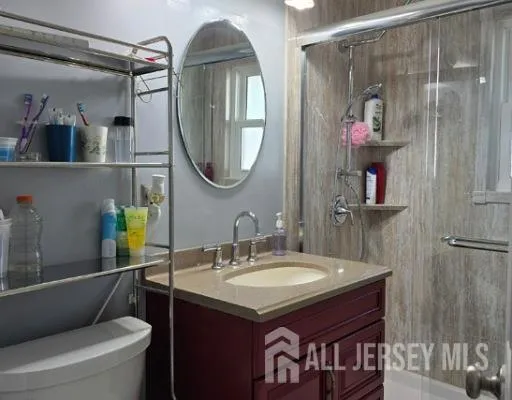 a bathroom with a sink vanity and a mirror