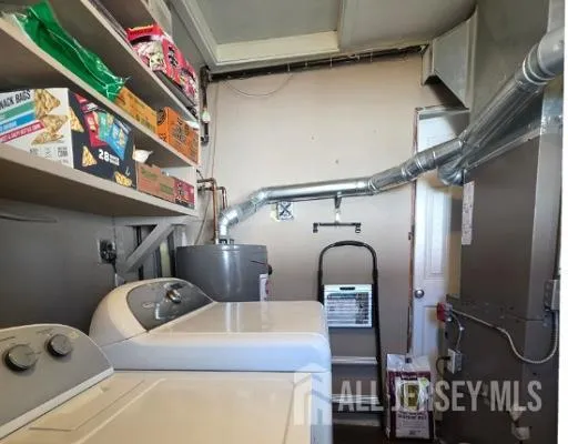 a room with lots of appliances and cabinets