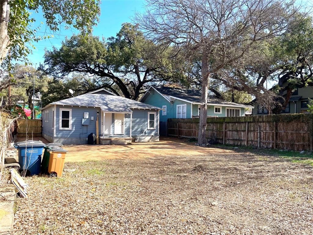 807 East Riverside Drive, Unit B Austin, TX 78704 - Photo 25 of 28 A quaint residential dwelling features an inviting facade and surrounding natural landscape.
