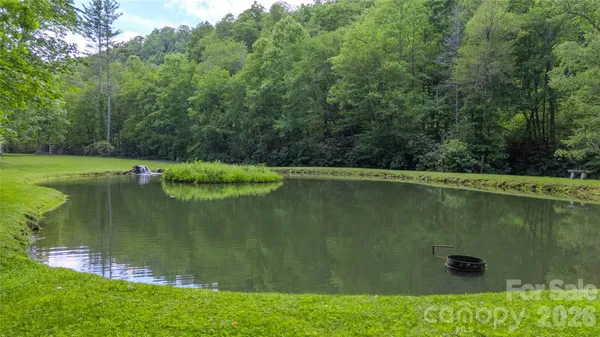 a view of lake with green space